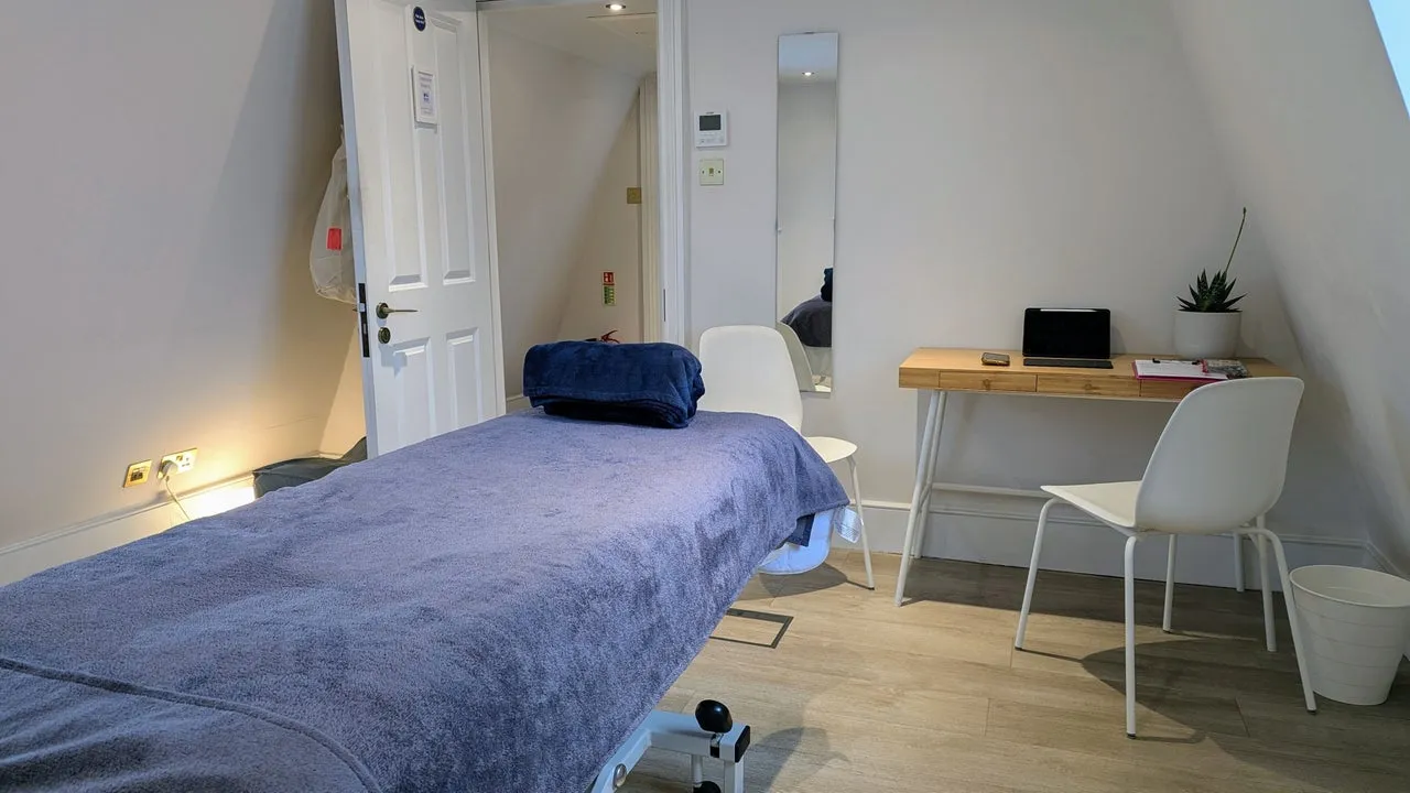 Treatment room with massage bed at Blackheath Yoga