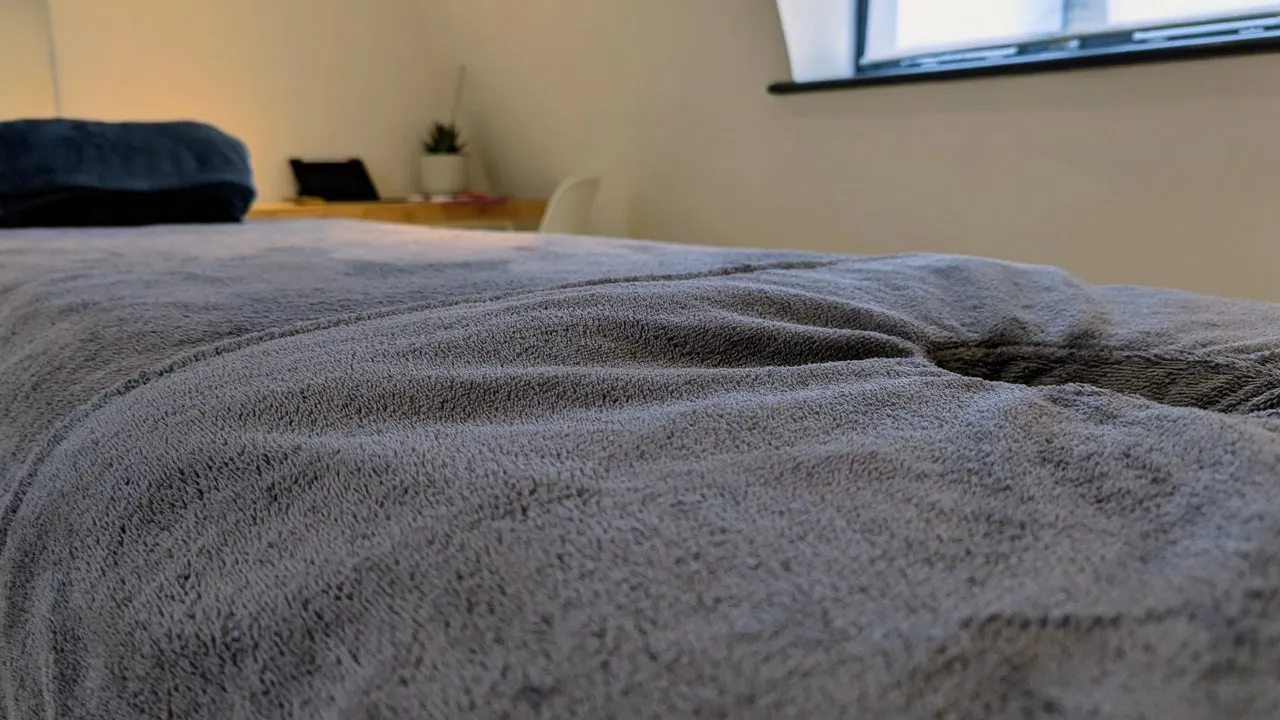 Close-up of soft towels on the massage bed