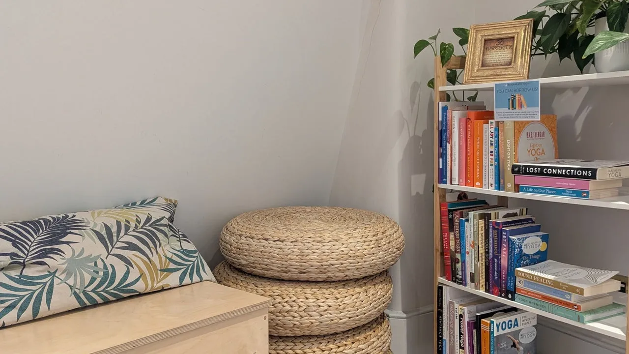 Cosy reading corner with wellness books at Blackheath Yoga